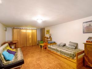 a living room with two beds and a table at Chalet Lilette in Font-Romeu-Odeillo-Via