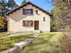 a small house with a pathway leading to it at Chalet Lilette in Font-Romeu-Odeillo-Via