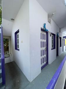 an empty hallway of a building with a door at Casablis homestay in Mysore