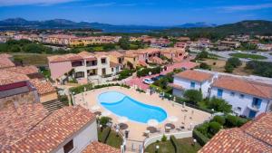 an aerial view of a resort with a swimming pool at Lazulite - Sardinia Suite in Murta Maria