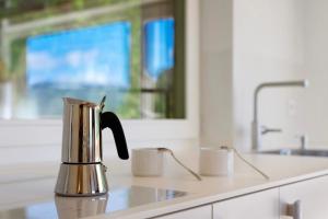 a coffee pot sitting on a counter in a kitchen at Höllerhof in Cornedo all'Isarco +53 photos