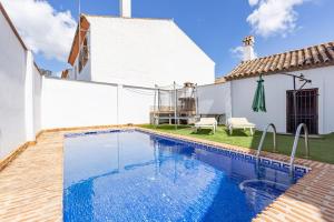 a swimming pool in the backyard of a house at Casa Jimena 2 personas in Jimena de la Frontera