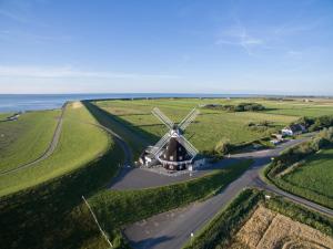 an aerial view of a windmill in a field at Fewo Nordermühle in Pellworm
