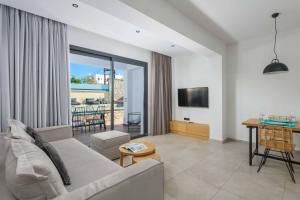 a living room with a couch and a table at Lambis Athina in Lindos