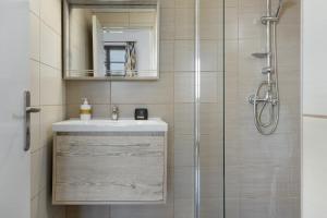 a bathroom with a sink and a shower at Frantzis studio 1 in Páloi