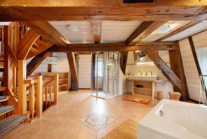 a large bathroom with a tub and a sink at Fewo Nordermühle in Pellworm +62 photos