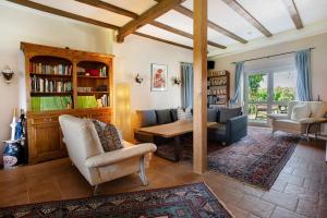 a living room with a couch and a table at Fereienhaus Usedom Achterland in Dewichow