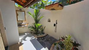 a patio with potted plants and a mirror on the wall at Amed Saïta Villas in Amed +60 photos