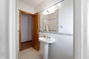a bathroom with a sink and a mirror at La Casa Del Bosque in Júzcar +33 photos