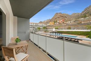a balcony with a view of the mountains at Bajamar en armonía in Bajamar