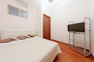 
Кровать или кровати в номере hth24 apartments on Marata 14
