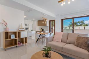 a living room and kitchen with a couch and a table at Michael in Torre de la Horadada