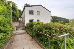 a white house with stairs leading up to it at Traumblick in Bad Liebenzell