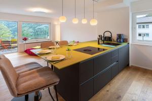a kitchen with a island with a yellow counter top at Traumblick in Bad Liebenzell