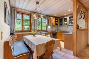a kitchen with a table and chairs in a room at Igelbau in Wolfach