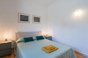 a bedroom with a bed with a towel on it at Villa Nonna Anna a Plemmirio in Syracuse +34 photos