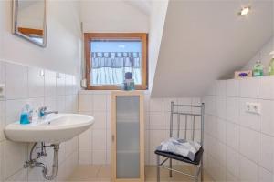 a bathroom with a sink and a window at Bergchalet Mirabell - Hofgut in Friedrichshafen +71 photos