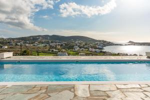 a swimming pool with a view of the water at Mont' Rock villas 2 in Posidhonía