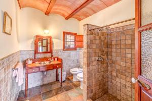 a bathroom with a shower and a sink and a toilet at Son Garrot in Santanyi