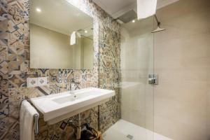a bathroom with a sink and a shower at Apartament Massanet 1c in Canyamel +21 photos