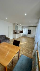 a living room with a table and a kitchen at Max Haus 2 in Karlstadt