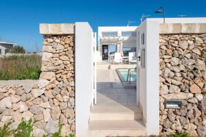 a stone wall and gate to a villa at Villa Venza , Salento in Otranto