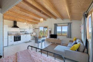 a living room with a couch and a table at Villa Dely in Tazacorte