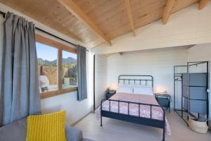 a bedroom with a bed and a window at Villa Dely in Tazacorte +22 photos