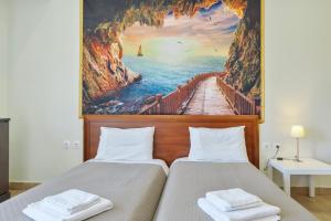 a bridge to the ocean wallpaper bedroom at Motel katerina in Keratea