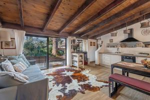 a living room with a couch and a table at Casa Palmera - Private Paradise in Tacoronte