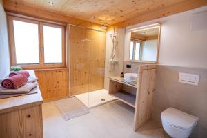 a bathroom with a shower and a toilet at Haus Hoalp in Au +21 photos