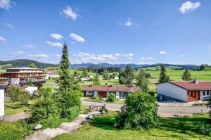 an aerial view of a village with mountains in the background at Ferienhaus Rommel in Stiefenhofen