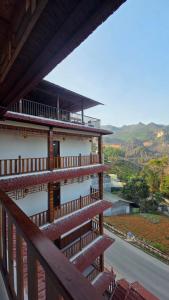 a balcony of a building with a view of a valley at Viet Son Lam Hotel in Dồng Văn