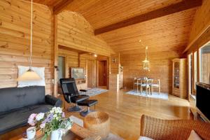 a living room with a couch and a table at Ferienhaus 'Albblick' in Starzach