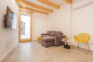 a living room with a couch and a table at Cas Suis 9 in Campanet