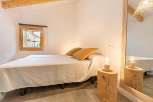 a bedroom with a bed in a room with a mirror at Cas Suis 9 in Campanet +37 photos