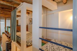 a couple of bunk beds in a room at Casa Encarnacion in Granada +23 photos