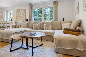 a living room with a couch and a table at Landhaus Schwerin in Kirch Jesar
