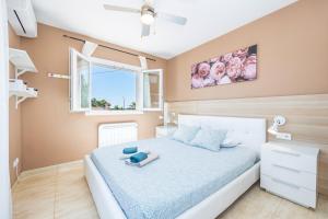 a bedroom with a bed and a window at Villa Amelia cerca de cala Pi in Llucmajor +25 photos