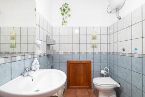a bathroom with a sink and a toilet at Vistamare2 in Cardedu