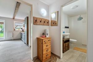 a bathroom with a sink and a toilet at Ferienhof Littmann in Friedrich-Wilhelm-Lübke-Koog +73 photos