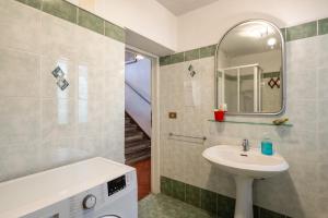 a bathroom with a sink and a mirror at Casa Claire in Prataccio +14 photos