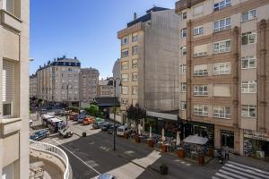 an overhead view of a city street with buildings at O Faro Apartamentos in Ribadeo