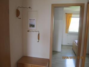 a room with a mirror and a door with a window at Landhaus Erben in Wasserburg +57 photos