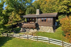 a small house with a fence in front of it at Haus-am-Harz Bad Gandersheim in Bad Gandersheim