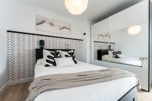 a bedroom with a large bed and a large mirror at Villa Sueños in Mijas +37 photos