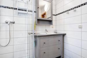 a bathroom with a sink and a shower at Fewo 14 - Halbinsel Darss - Ostsee in Wieck +34 photos