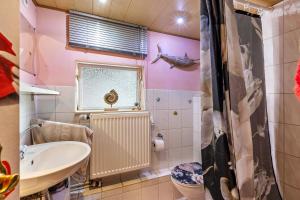 a bathroom with a sink and a toilet at Haus Luise in Stapelburg +11 photos