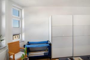 a room with a bed and a sliding glass door at Ferienwohnung Eichendorff in Nordhausen