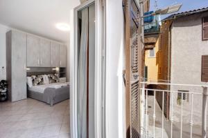 a view of a bedroom from a balcony at Edda's apartment in Altare